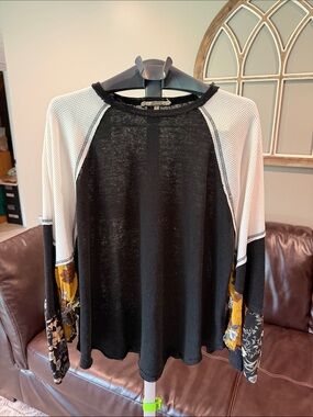 Black and White Raglan Long-Sleeve Top with Floral Accent